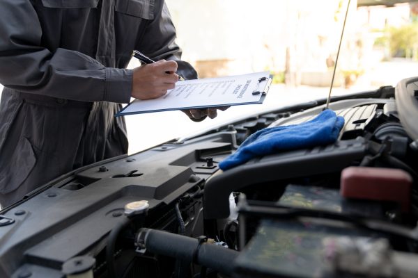 Maintenance engineer or auto mechanic checking car database usage history Enter the details in the f